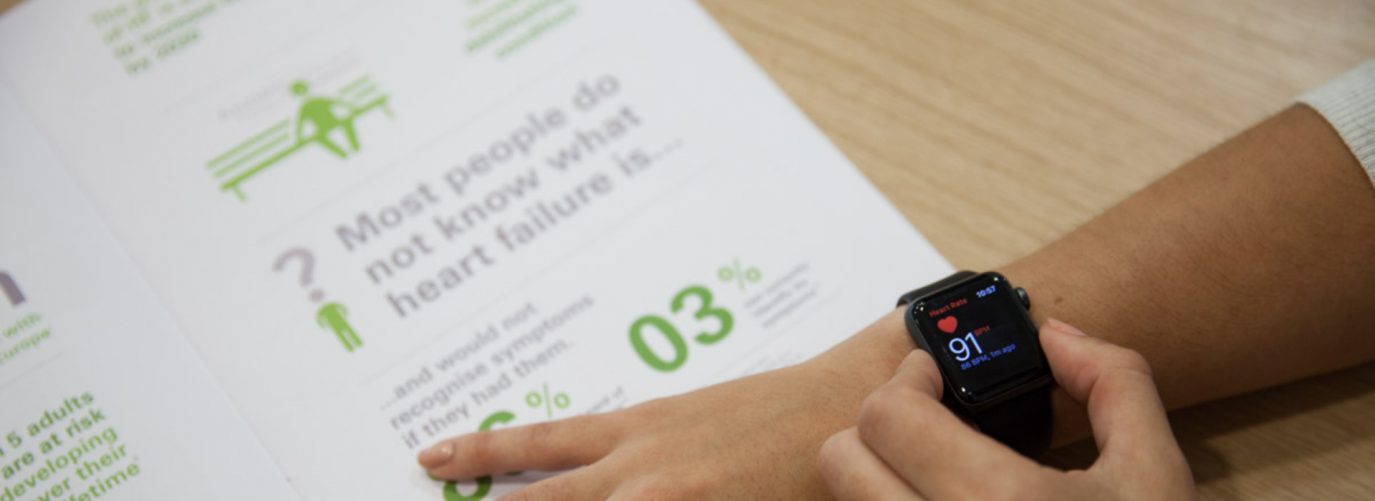 person using their smartwatch to look at heart rate